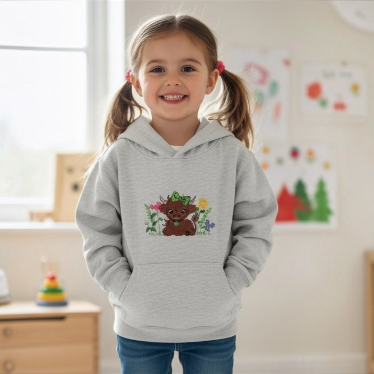 Childs Hoodie embroidered with a Highland Cow and Flowers