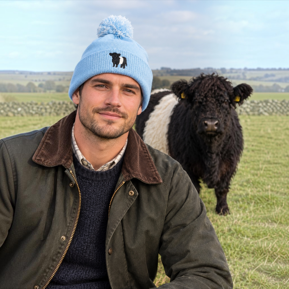 Bobble hat with Belted Galloway Cow Embroidered Design